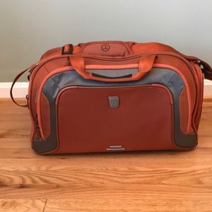 Like new Tumi tech burnt orange duffel bag